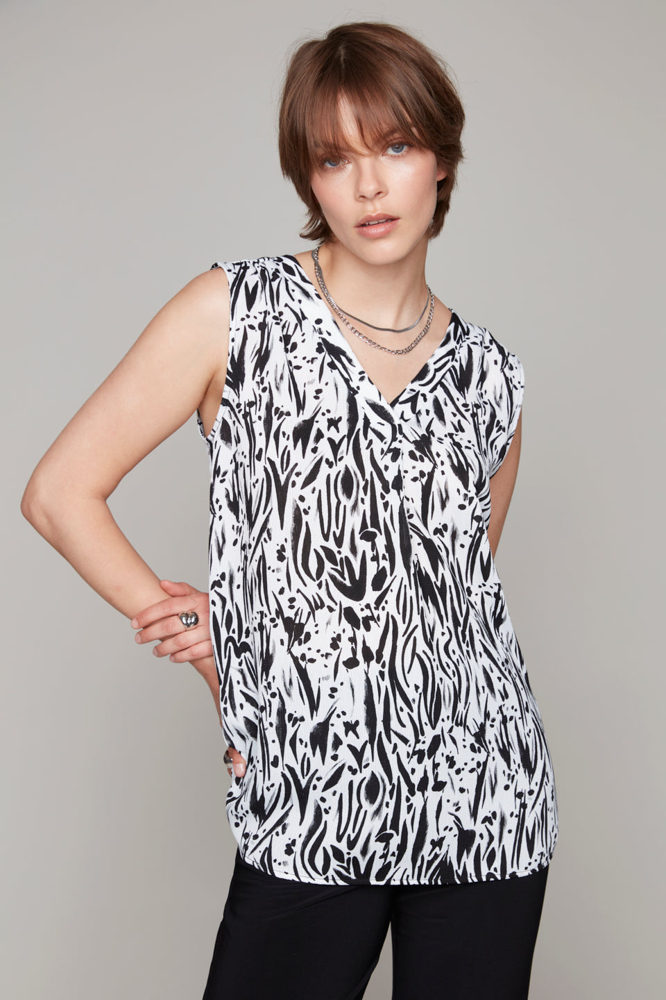 Compli K sleeveless top with rounded hemline