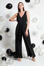 Load image into Gallery viewer, Compli K Noir sleeveless v-neck jumpsuit with novelty tie-front detail
